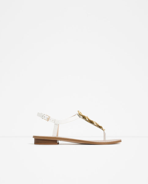 FLAT LEATHER SANDALS WITH FLORAL DETAIL